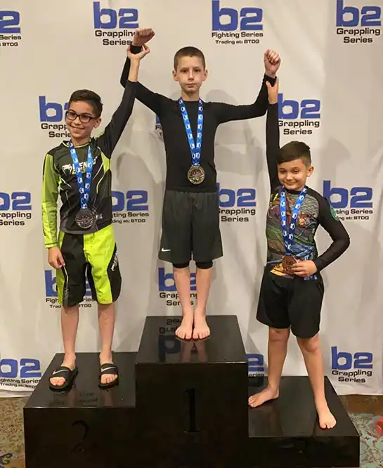 teens-on-podium-jiu-jitsu-tournament